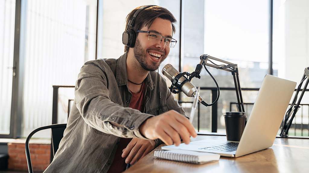 Man with podcasting equipment